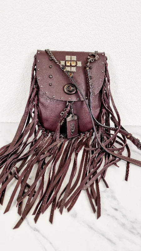 Party Bags For New Year's Eve And Special Occasions Coach 1941 Fringe Saddle Bag with Pyramid Rivets in Oxblood Smooth Leather & Ram Charm - Coach 48617 Party Bags For New Year's Eve And Special Occasions Coach 1941 Fringe Saddle Bag with Pyramid Rivets in Oxblood Smooth Leather & Ram Charm - Coach 48617